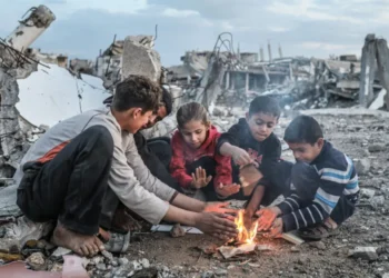 Displaced families in broken tents struggle during storm in Gaza